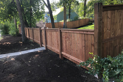 Cedartone fence and fresh top soil yard