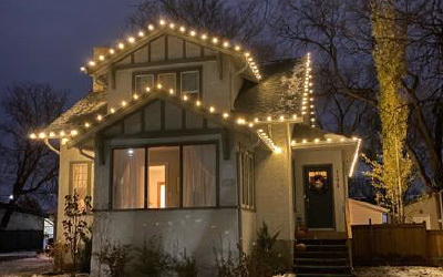 Christmas lights hanging on eaves of house