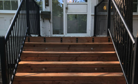 Wood steps made using cedartone wood and aluminum railing
