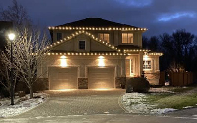 Large house with glowing christmas lights